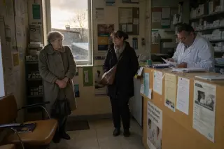 Three diverse passengers riding a French train, each absorbed in thought, naturally lit by soft daylight, subtle tensions and differences visible in posture and detail.
